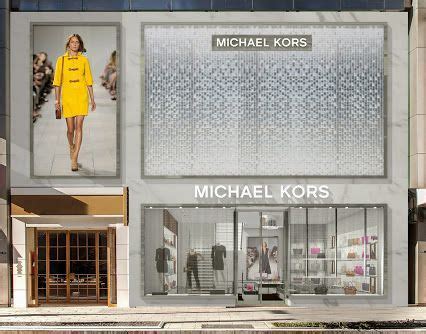 michael kors acquired|who bought michael kors.